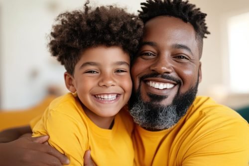A joyful image of a father and son wearing matching yellow shirts, their smiles reflecting the brightness of their bond and the happiness they bring to each other.